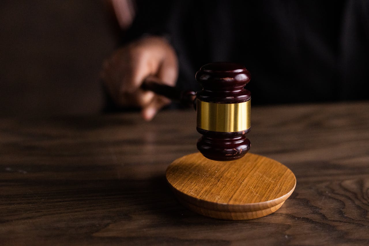 Judge’s gavel symbolizing delayed justice and the need for reform in Georgia’s legal system.